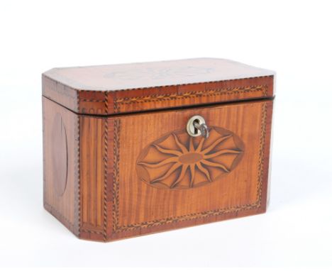 A Georgian satinwood rectangular tea caddy with canted corners. Cross banded in mahogany and with marquetry inlay. Having mot
