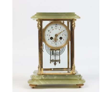 A French onyx and brass cased four glass mantel clock. With enamel dial having Arabic numeral markers and flower swags. Housi