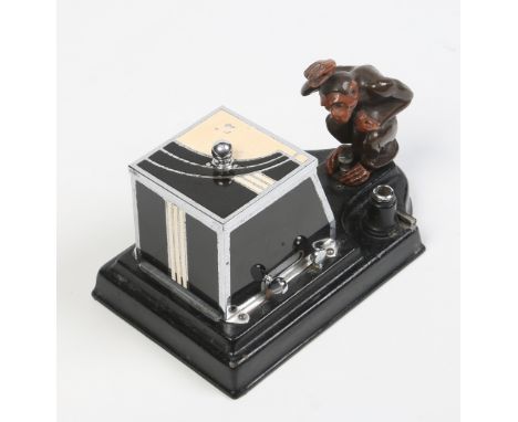 A novelty Art Deco Ronson Pik-A-Cig automaton cigarette dispenser. With enamelled cigarette box and surmounted by a cold pain