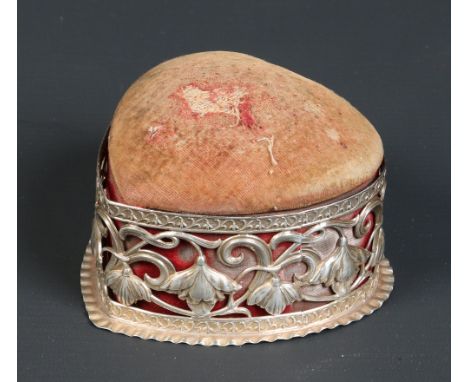 A Victorian silver mounted heart shaped trinket box with pin cushion cover. With pierced decoration depicting stylized flower