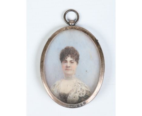 A Victorian oval ivory portrait miniature of a lady in a silver frame. Assayed Birmingham 1898, 7.25cm. Condition Report. To 