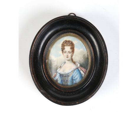 An oval ivory portrait miniature of a lady in carved frame.  Condition Report. To be used as a guide only. Back stuck in with