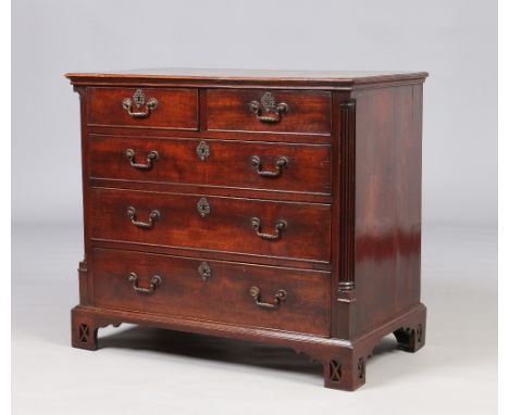 A George III small mahogany two over three chest of drawers. With original brightwork, raised cock beading, fluted quarter co