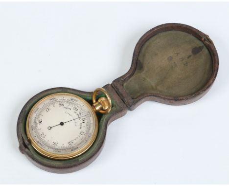 A gilt brass compensated pocket barometer with silvered dial and in fitted leather case, 7cm. Condition Report. To be used as