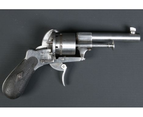 A Victorian six shot pin fire revolver with cross hatched scales. Barrel 8.5cm. Condition Report. To be used as a guide only.