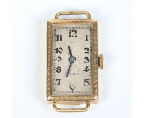 A ladies Rolex 18 carat gold cased Art Deco manual watch head. With exaggerated dial in silvered finish and with Arabic numer
