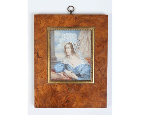 A portrait miniature of a woman in walnut frame, 10cm x 8cm. Condition Report. To be used as a guide only. Good condition.