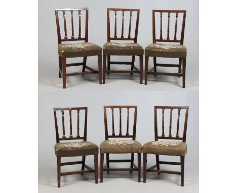 A set of six Georgian mahogany dining chairs. With carved stick back rests and raised on square tapering supports.  Condition