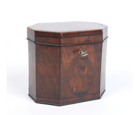 A George III mahogany tea caddy with canted corners and ivory escutcheon. With strung ebonized inlay and mouldings and having