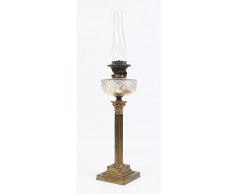 A brass based oil lamp raised over a fluted corinthian column and with cut glass font, 55cm. Condition Report. To be used as 