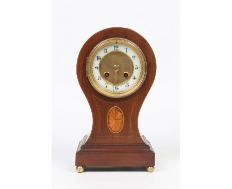 A nineteenth century French mahogany cased balloon mantel clock. With strung inlay, marquetry panel and raised on brass ball 