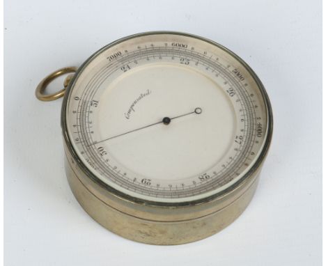 A brass cased compensated pocket barometer with silvered dial, 7.5cm diameter. Condition Report. To be used as a guide only. 