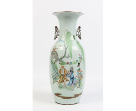 A nineteenth century Chinese baluster floor vase with pierced twin handles. Decorated in coloured enamels with figures and wi