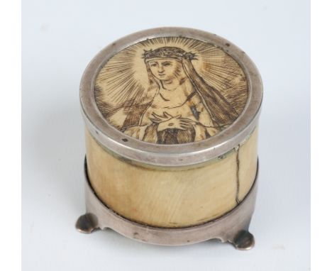 A nineteenth century French ivory circular box and cover with white metal mounts and glass liner. With incised portrait to th