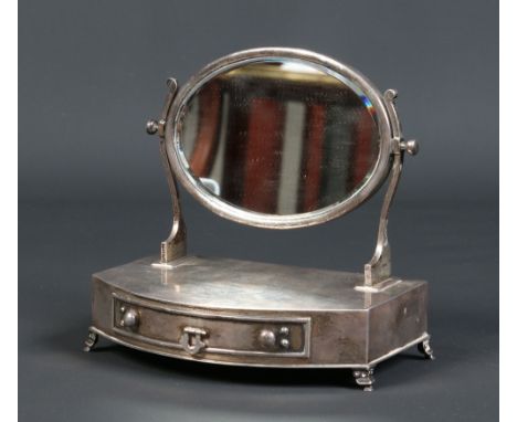 An Edwardian silver novelty trinket box formed as a single drawer bow fronted dressing table mirror. Assayed Birmingham 1904.