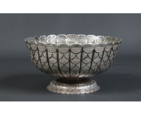 A nineteenth century Indian silver fluted pedestal bowl. Decorated with bands of textured scales, 19cm diameter. Condition Re