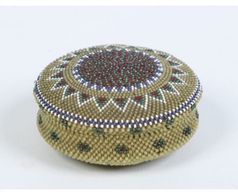 A small yellow ground circular beadwork trinket box and cover 6cm diameter. Condition Report. To be used as a guide only. Goo