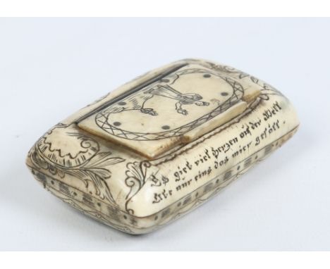 An eighteenth century German carved horn snuff box. With incised decoration depicting a townscape and with inscriptions, 7.25