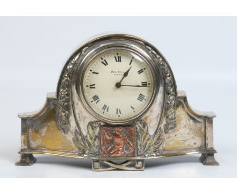 An early twentieth century dome topped mantel clock in silver plated case chased with husk and fruit garlands and with a copp