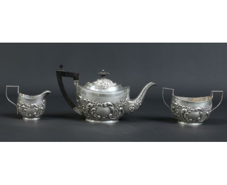 A Victorian silver three part bachelors tea service by William M. Hayes. Chased with acanthus scrolls and flower heads. Assay