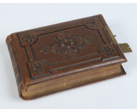 A Victorian leather bound musical photograph album with brass clasp. No photographs, 23.5cm. Condition Report. To be used as 
