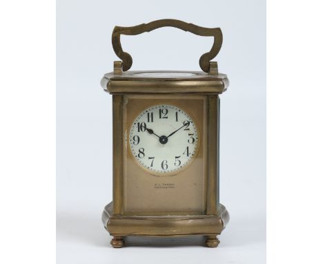 A French early twentieth century brass cased carriage clock having platform escapement. With gilt mask and enamel dial with A