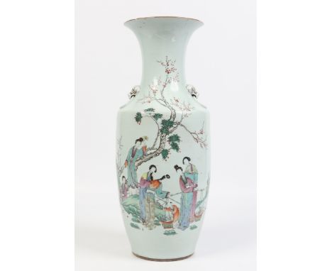 A Chinese baluster vase. With mask moulded handles, painted in coloured enamels with women in a garden landscape and with poe