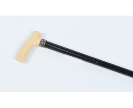 A Victorian ebonized walking stick with silver collar and carved ivory handle. Assayed Birmingham 1890, 92cm. Condition Repor