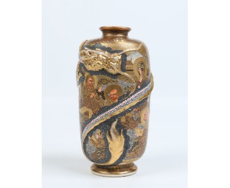 A Japanese Meiji period Satsuma vase moulded with a scrolling dragon and decorated in gilt and enamel with a continuing lands