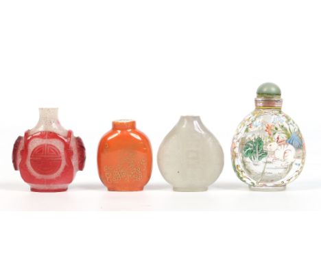 A Chinese painted rock crystal snuff bottle with jade stopper, an orange ground porcelain snuff bottle, a Peking glass exampl