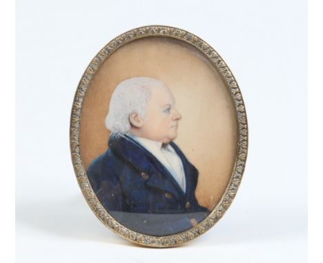 An early twentieth century ivory portrait miniature of a gentleman wearing a blue overcoat in brass strut frame, 9.5cm. Condi