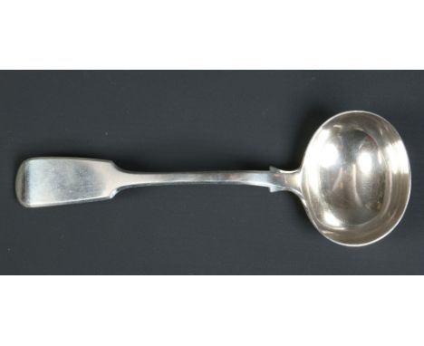 A Victorian silver fiddle pattern sauce ladle by Elizabeth Eaton. Assayed London 1851. 76 grams, 18cm.  Condition Report. To 