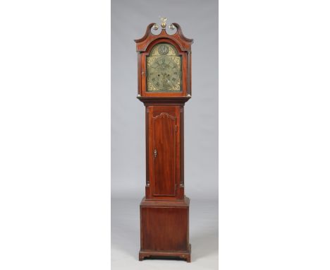 A nineteenth century mahogany eight day longcase clock. With brass arch top dial ornamented with spandrels and a relief medal