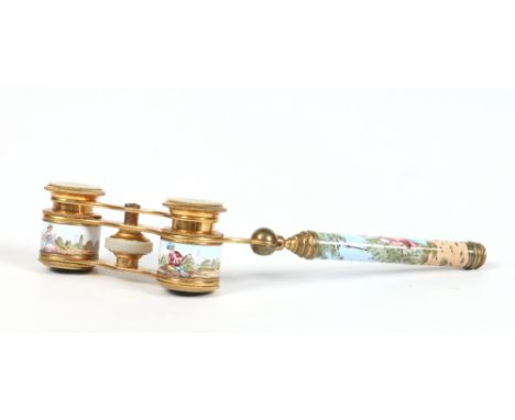 A pair of late nineteenth century French lacquered brass opera glasses with folding handle. With mother of pearl mounts and h