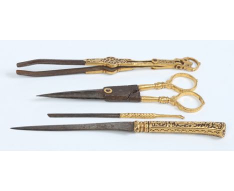 A set of early nineteenth century Indian steel grooming tools with gold overlaid decorations, longest 15cm.