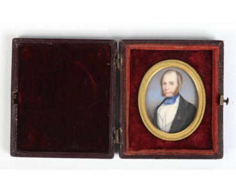 A Victorian ivory portrait miniature of a gentleman with gilt brass bezel and in velvet fitted leather case, 7cm. Condition R