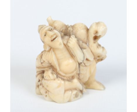 A Japanese carved ivory netsuke formed as a resting nomad, 4cm. Condition Report. To be used as a guide only. Hair cracks.