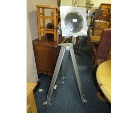A MODERN INDUSTRIAL STYLE TRIPOD FLOORSTANDING LAMP