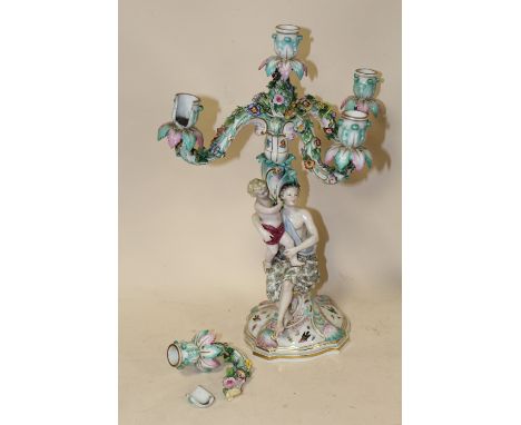 A PAIR OF MEISSEN STYLE FIGURAL FIVE BRANCH CANDELABRA, each column modelled as a seated lady holding a child, the removable 