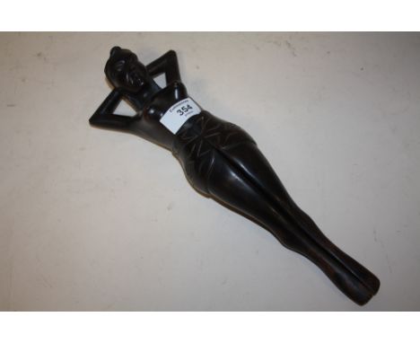 A NOVELTY TREEN NUTCRACKER IN THE FORM OF A FEMALE WITH OPENING LEG, H 33 cm