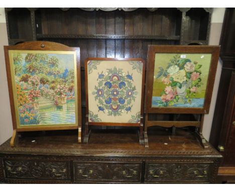 THREE VINTAGE OAK FRAMED TAPESTRY FIRE SCREEN ( ONE FOLDS UP )