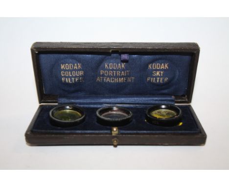A CASED SET OF THREE VINTAGE KODAK CAMERA LENSES 