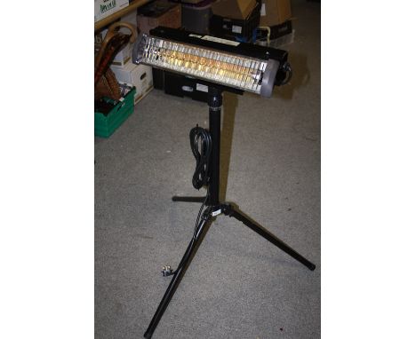 AN ELECTRIC HEAT LAMP ON TRIPOD BASE