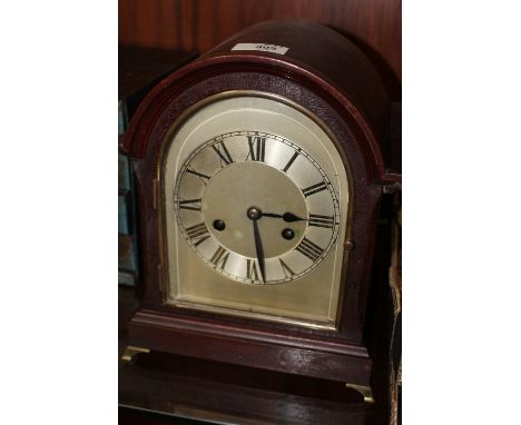 A VINTAGE MAHOGANY DOME TOPPED MANTEL CLOCK
