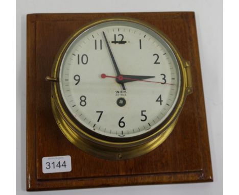 Vintage brass bulkhead clock  "Astral" by Smiths. In need of a service.