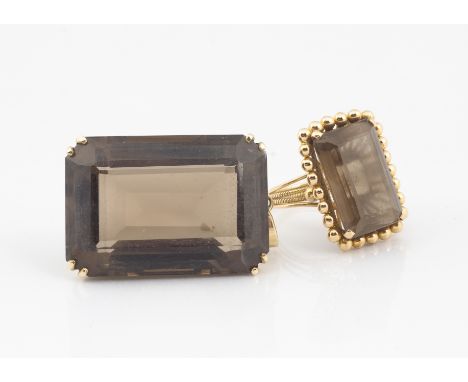 A continental smoky quartz dress ring, the yellow metal basket and rope twist setting with centred step cut smoky quartz toge