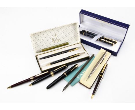 A small group of pens, including a modern Waterman fountain pen and roller ball set in a box, a Parker box with fountain pen 