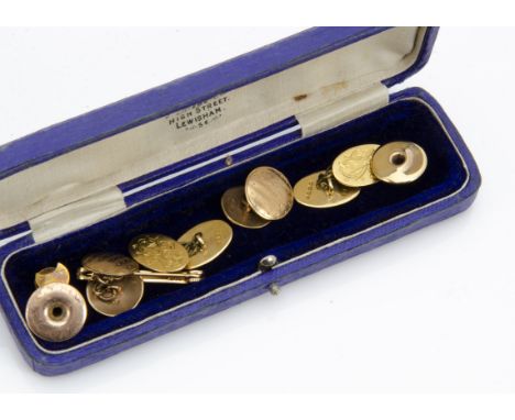 A pair of 18ct gold monogrmmed oval link cufflinks, 8.2g, a pair of 9ct gold circular linked and engine turned cufflinks, 15c