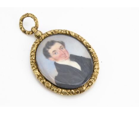 An early 19th Century portrait miniature hanging fob, the oval three quarter length portait of a young gentleman in black fro