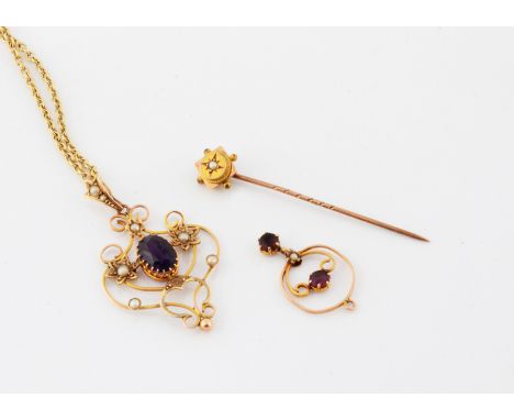 An Edwardian 9ct gold amethyst Art Nouveau pendant and chain, together with a similar pendant and a seed pearl stick pin 